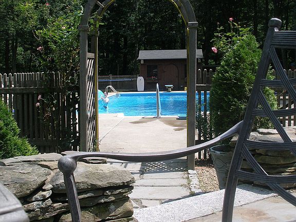 Pool area, heated pool & pool house