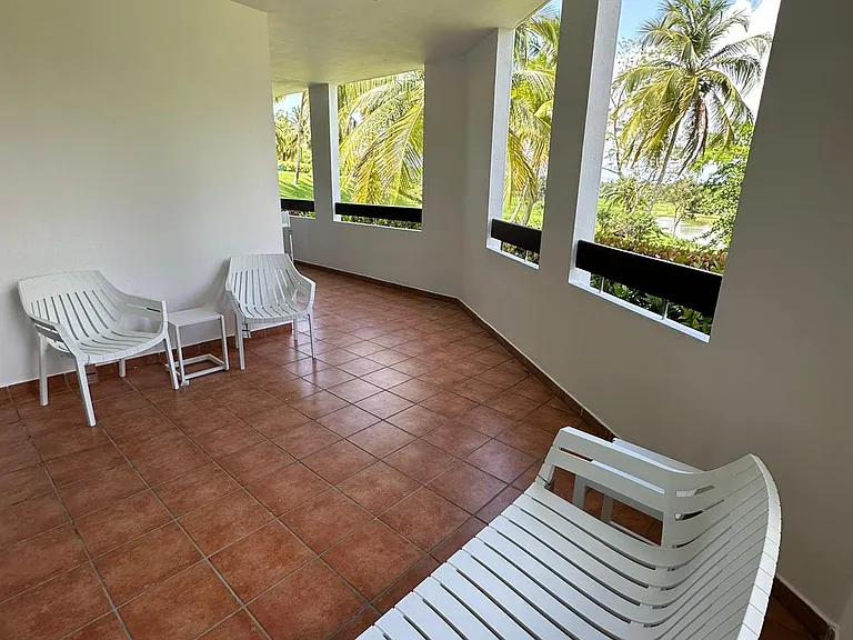 Spacious balcony overlooking the golf course and lush landscaping