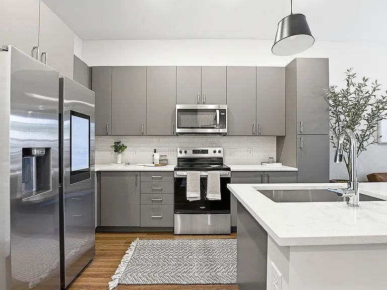 Kitchen with ENERGY STAR_ stainless appliances, quartz countertops and smart refrigerator