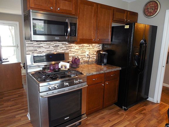 Updated Kitchen With Stainless Steel Appliances.