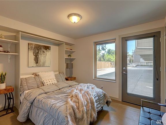 3rd bedroom with wall bed on entry level and private back entrance.
