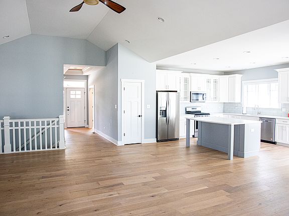 Large open living room looking into kitchen