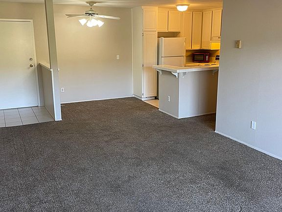 Open layout. 
Looking at front door, dining room and kitchen from living room