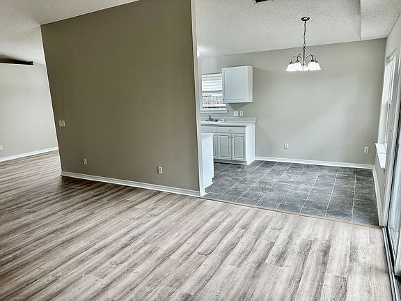 living room looking into the eat in kitchen