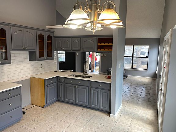 Nice sized kitchen with plenty of cabinet space and Quartz counter tops and Stainless Steel Appliances (not shown in photo)
