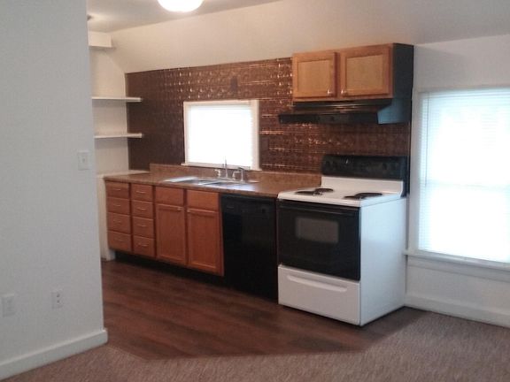 Kitchen with self-cleaning oven and dishwasher and new flooring