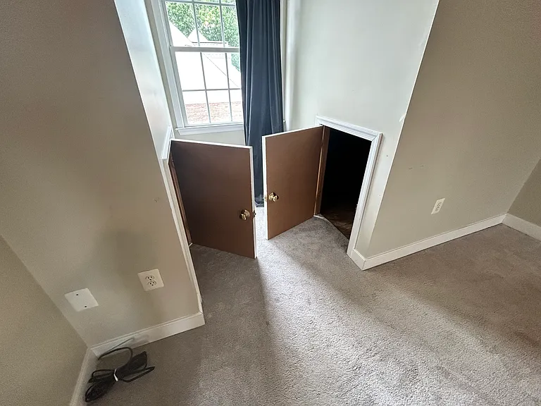Two openings of three storage closets on top floor.