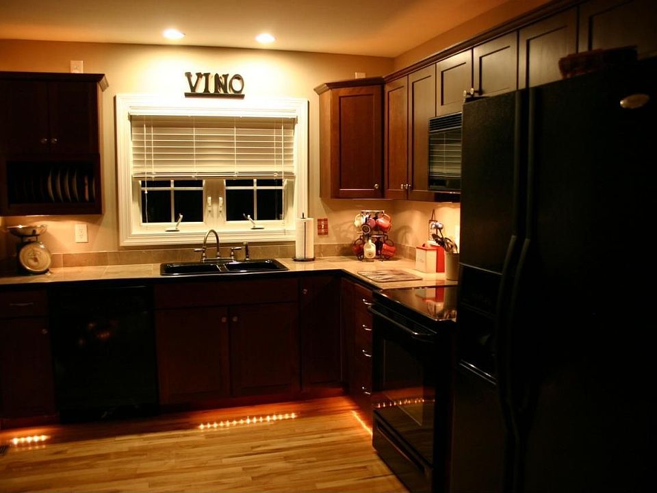 Kitchen has custom lighting features.