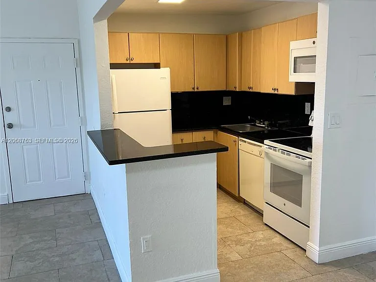 7110 NW 179th St #310 — Photo 1