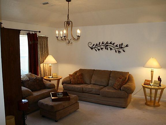 The living room is to the right of the entry.  It could be used as a dining room or study as well.
