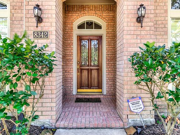 This beautifully maintained brick and wood contemporary home was built in 1999.