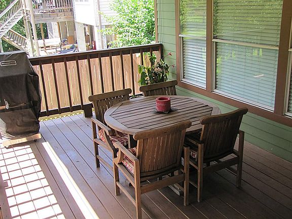 ENJOY THE CREEK VIEWS FROM YOUR COVERED & ELEVATED BACK PORCH