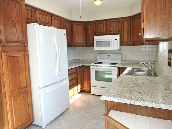 Updated kitchen with new counters and vinyl floor.