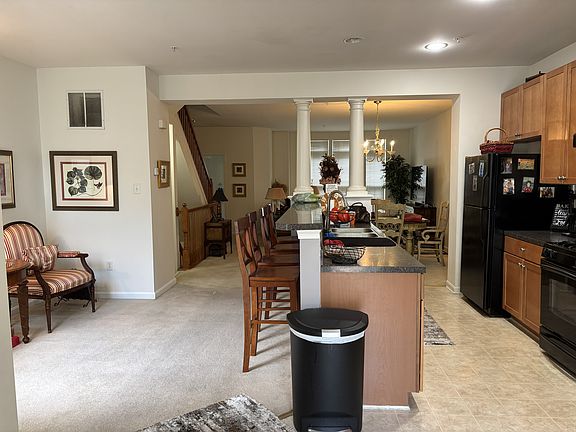 Kitchen with Formal Dinning and Living Room in the Background