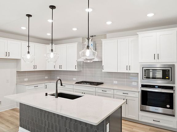 Gourmet Kitchen with Tile Accent on Island