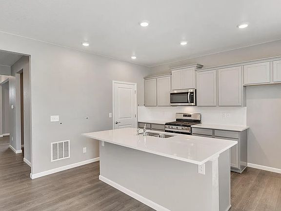 Kitchen + Pantry (the home comes with the refrigerator + dishwasher)