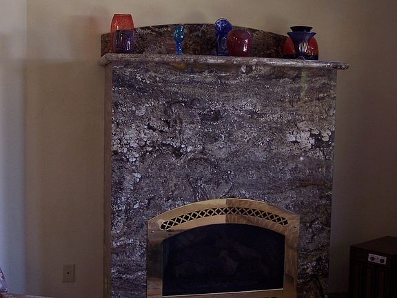 New granite fireplace in sunken living room