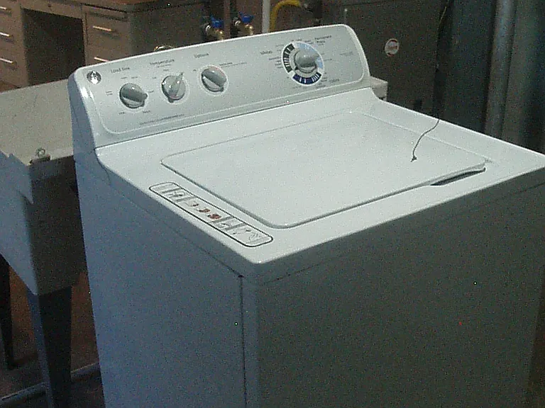 Washer, the washer and dryer are 50 dollars extra a month for rent, a 2 year lease comes with a 50 dollar reduction in rent, so the signing of a 2 year lease gets you a washer and dryer for free.