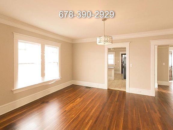 Spacious bright dining room with updated lighting