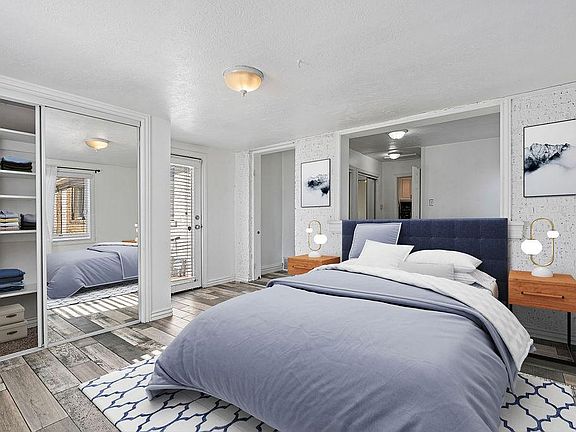 Back bedroom with lots of closet space and access to back patio door. This room is "shotgun" style meaning you have to walk through the first bedroom to get to the back bedroom or vis versa if you are entering from the back yard. The back bedroom is not