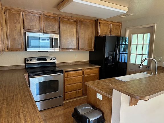 Kitchen with stainless steel appliances.