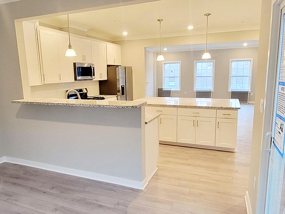 sunroom view of open living area with sliding glass door to