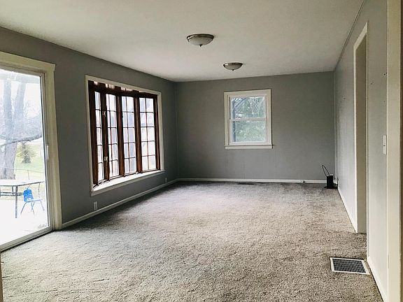 Sliding doors to deck, patio, and HUGE fenced yard.