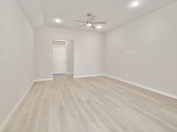 Living Rom in the Ash home plan by Trophy Signature Homes - REPRESENTATIVE PHOTO