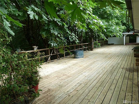 Open concept at its best. Notice the deck beyond that runs the full length of the house and wraps around to the left.