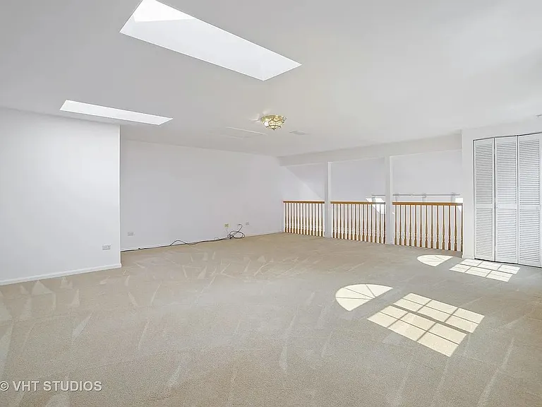 Additional level of living on top floor. Used as rec area, third bedroom or office. Newly carpeted