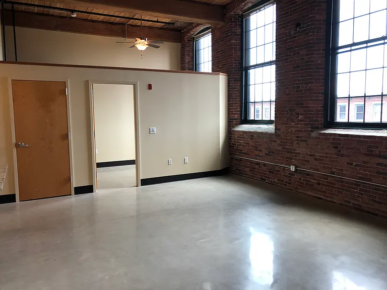 1 BR view into bedroom with 8' partition.
