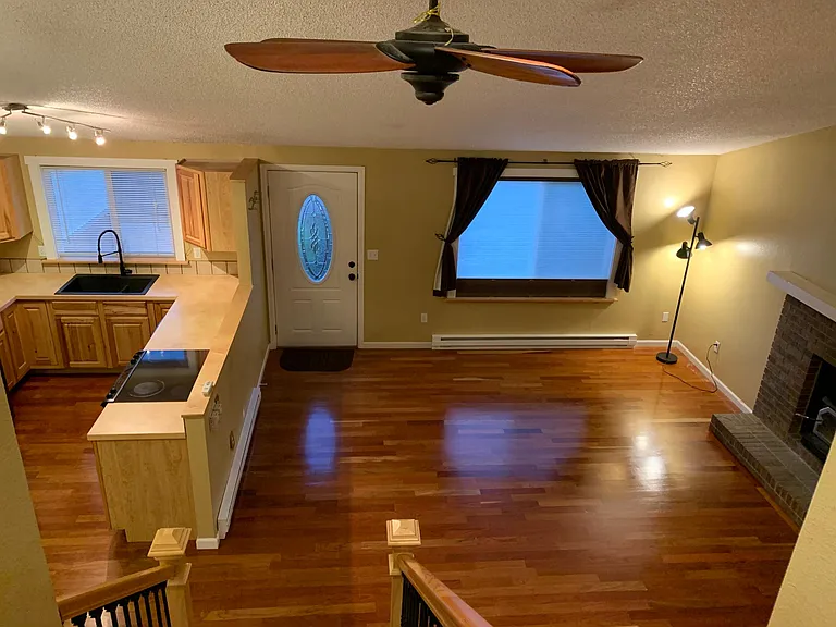 Looking down from top floor landing; giant fan circulates the air throughout the house