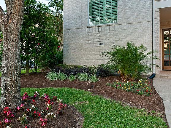 Front entry area. French doors across the front.Lots of archways and wood trim.
