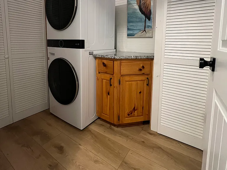 Lower level laundry room with new washer and dryer. Down the hall from bathroom and bedroom.