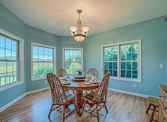 Dining room overlooking rolling hills.