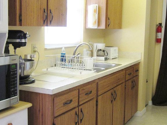 Kitchen with window overlooking back yard