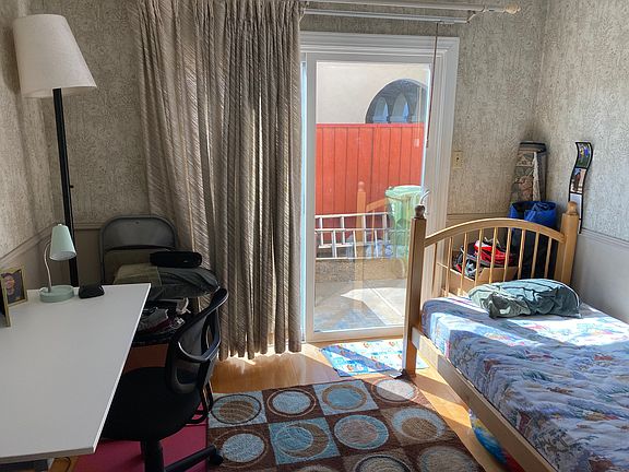 bed room with patio door open