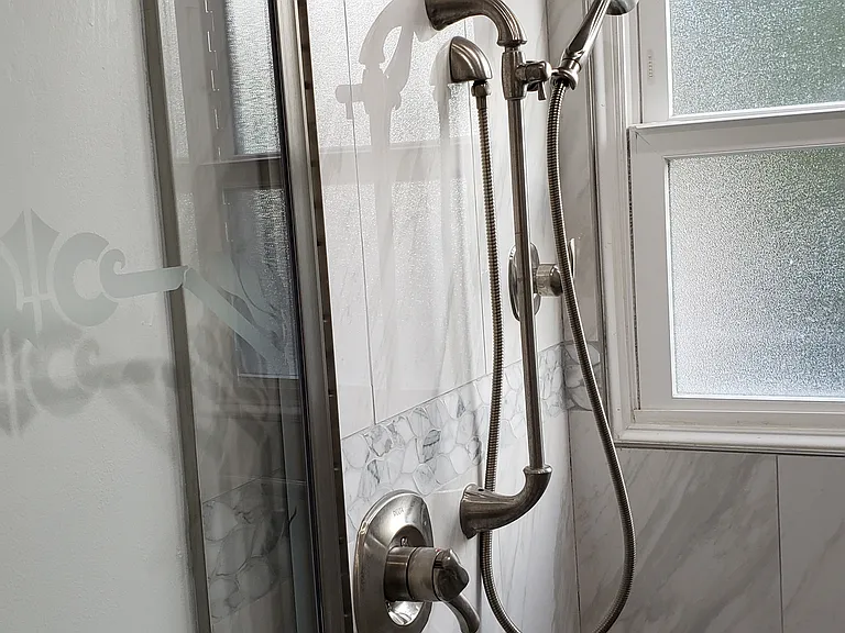 Showerhead, shower hose and window.