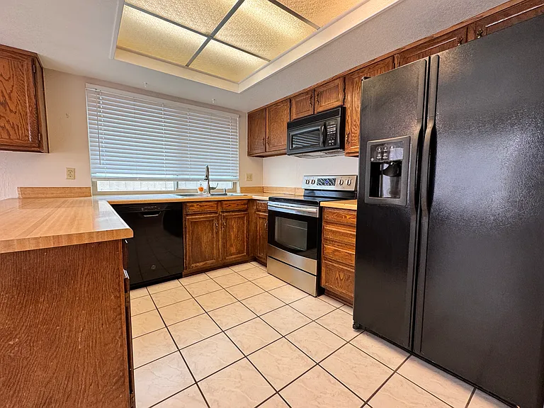 Kitchen includes refrigerator.