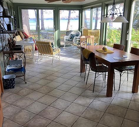Sun room and main eating area during summer months with great view of the lake.