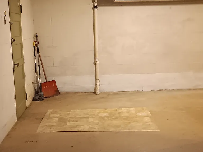 Basement view , door to garage.