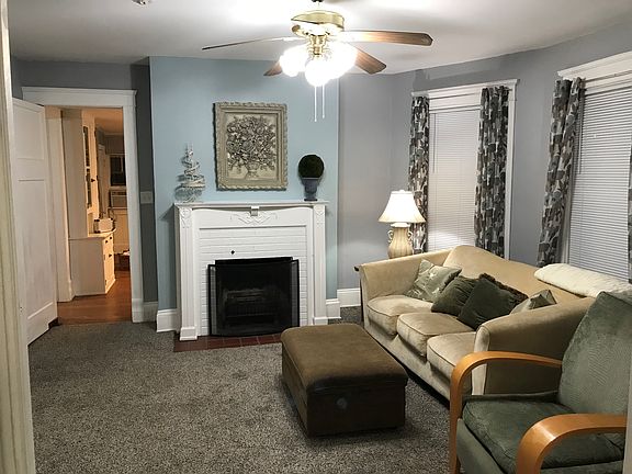 View of fireplace/entrance to kitchen.