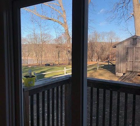 Sliding glass doors lead to a small deck in living room