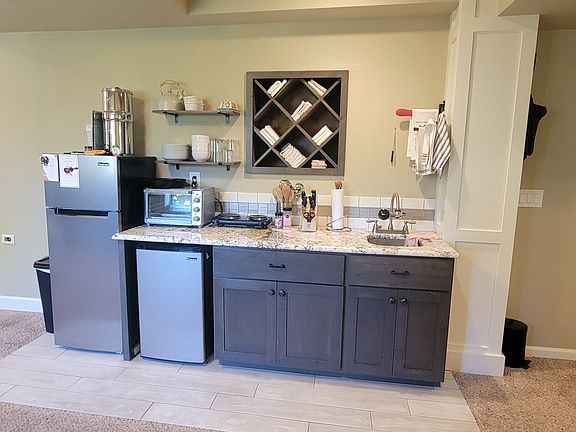 Kitchenette. Mini-bar fridge and 7.2 cubic feet fridge and freezer, countertop convection oven, countertop microwave and electric two-burner stove.