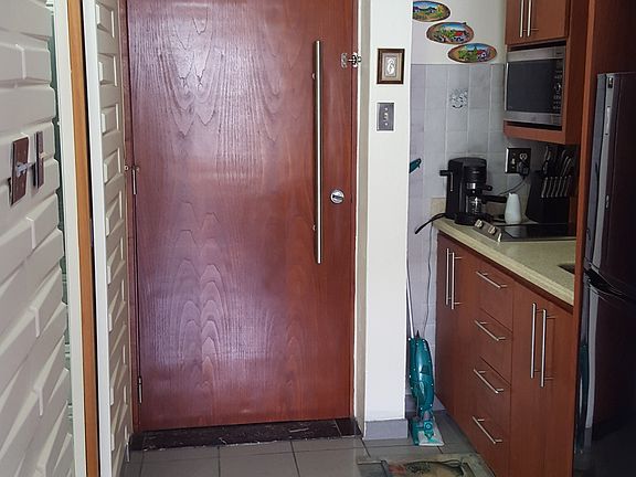 View of the kitchen and door