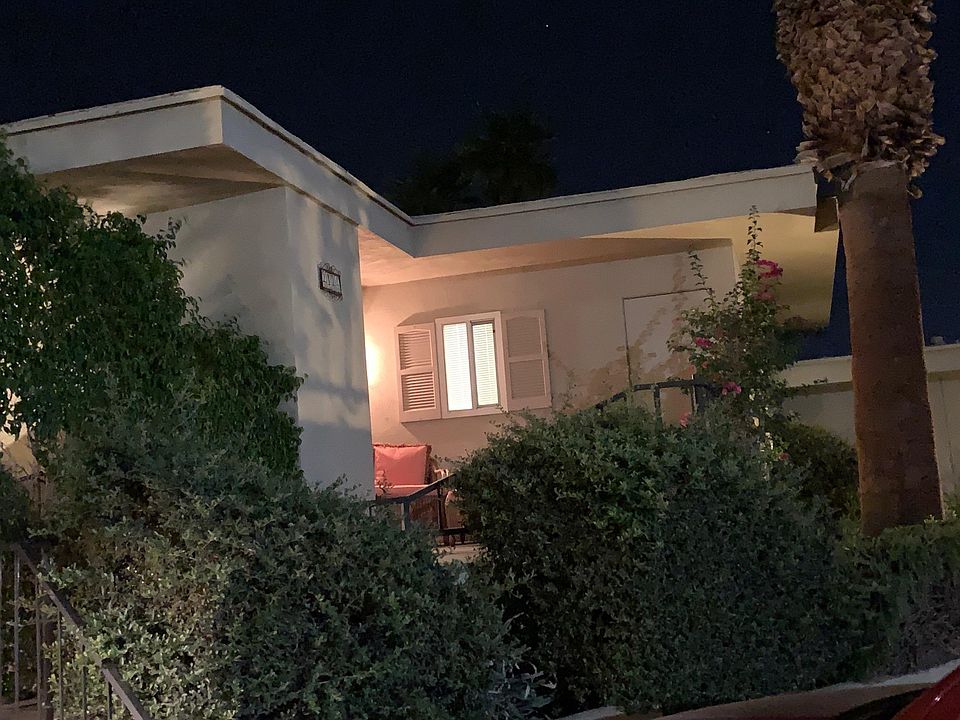 Parking by the stairs to the front porch of the condo. On the left is a nice grassy area perfect for pets to utilize.