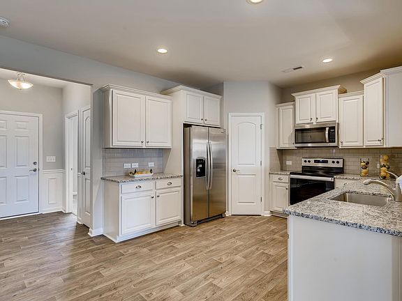 Stainless appliances and corner pantry.