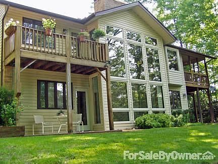 Rear View : Mstr Bdrm Balcony on left Cvrd Deck/Porch on right Gst Bdrm Patio on lwr left