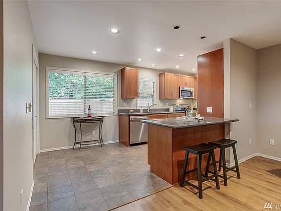 The kitchen could accommodate a small table, but you might want to keep it open as this home has a gorgeous dining room as well. You'll find the utility closet here; washer/dryer are included.