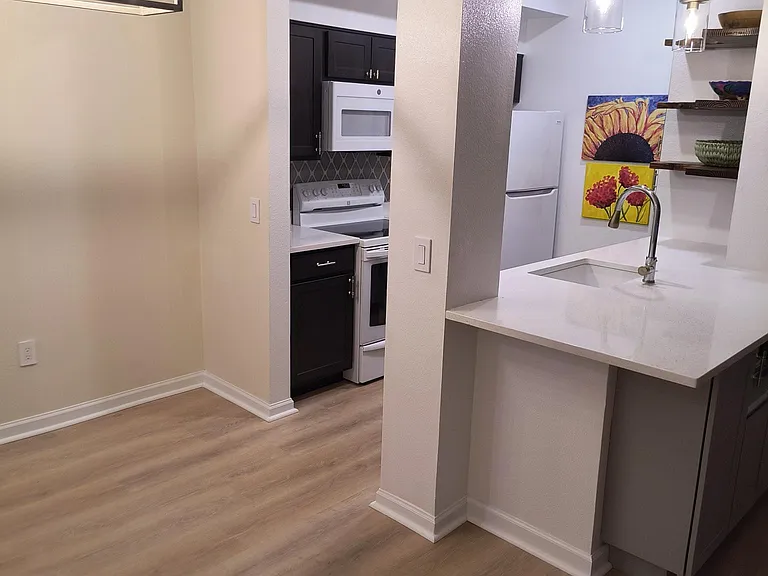 Dining area. Open floor plan to kitchen and living area.